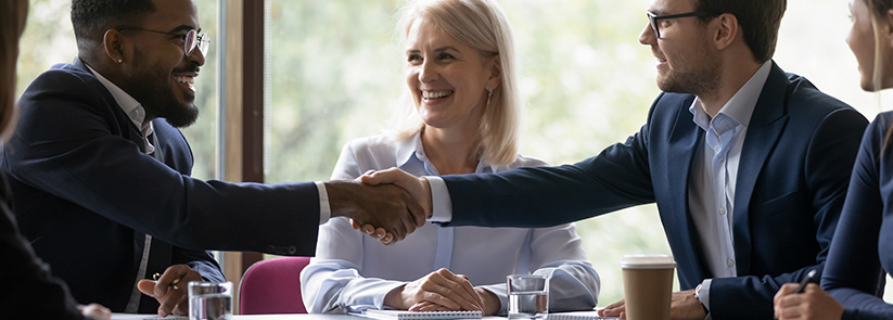 Franchisor Meeting Potential Franchisee Shaking Hands, Evaluating His Qualifications To Own a Future Franchise