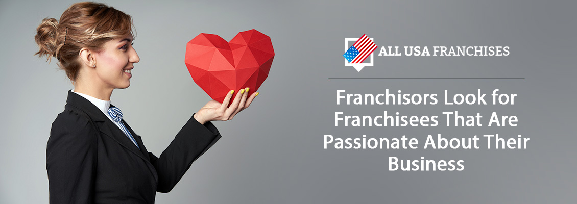 A Potential Franchisee Holding a Paper Heart Representing Her Passion, Which Franchisors Look for in Franchisees
