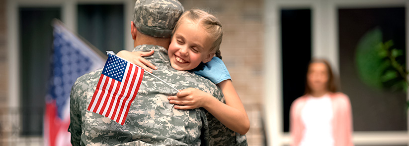 Veteran Hugging Daughter As Wife Watches, Returning Home To Build a Future With a Franchise Opportunity