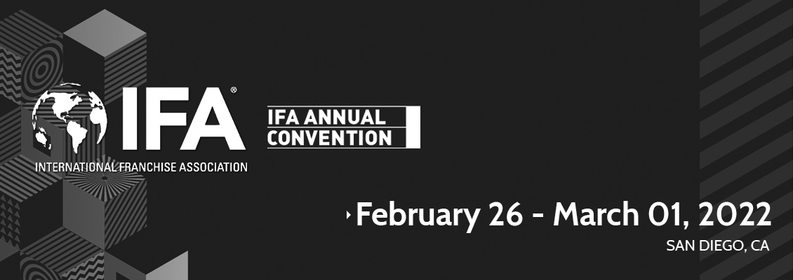 The International Franchise Association Logo With a Background of Colored Cubes